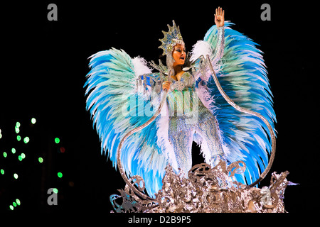 A dancer of Imperatriz samba school performs atop a float during the Carnival parade in Rio de Janeiro, Brazil. Stock Photo