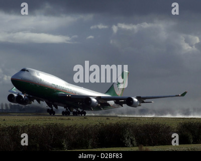 Eva Air Boeing 747-400 B-16461, a large wide-body airliner, is seen landing at an airport. This aircraft is part of Eva Air’s long-haul fleet, known for its capacity and comfort on international routes. Stock Photo
