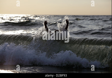 Kägsdorf, Germany, a boy is run over by a wave Stock Photo