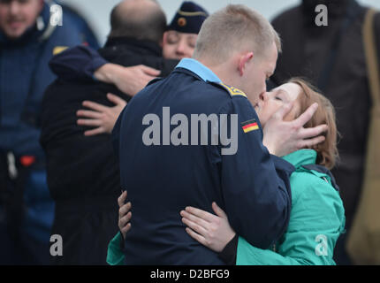 A crew member says good bye to his girlfriend on deck of the frigate 'Hessen' before it leaves the naval base in Wilhelmshaven, Germany, 19 January 2013. For the first time, the frigate is flagship of a Nato task force. Photo: Carmen Jaspersen Stock Photo