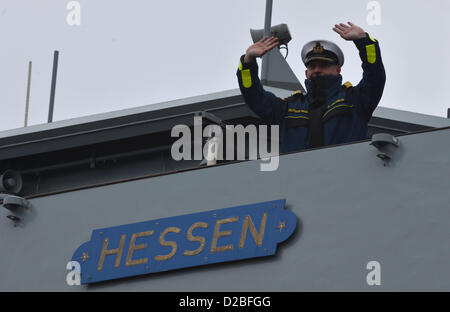 Commander of the frigate 'Hessen' Dirk Jacobus waves as the ship leaves the naval base in Wilhelmshaven, Germany, 19 January 2013. For the first time, the frigate is flagship of a Nato task force. Photo: Carmen Jaspersen Stock Photo