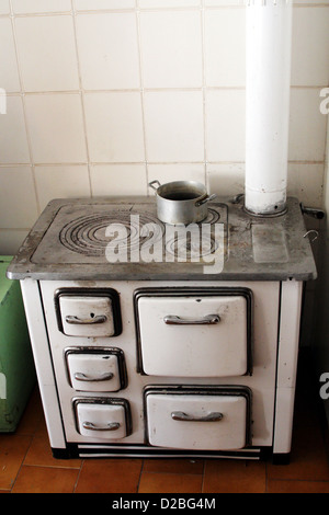 old wood stove in a mountain house Stock Photo