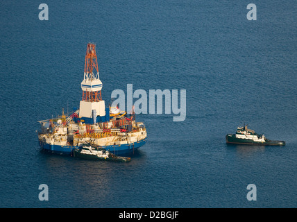 The stranded Arctic-class drilling unit the Kulluk is towed to a safe harbor off Kodiak Island January 7, 2013 in the Gulf of Alaska . The Kulluk will undergo a safety assessment before resuming its journey to Seattle for repairs and maintenance. Stock Photo