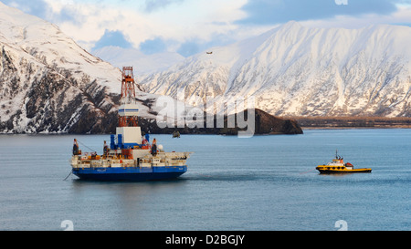 The stranded Arctic-class drilling unit the Kulluk receives supplies after being towed to a safe harbor off Kodiak Island January 7, 2013 in the Gulf of Alaska . The Kulluk will undergo a safety assessment before resuming its journey to Seattle for repairs and maintenance. Stock Photo