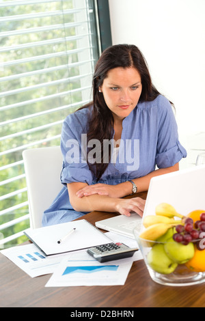 Young woman working using laptop studying office internet business Stock Photo