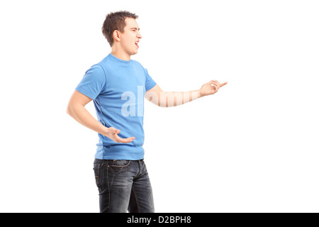 Young angry male pointing with finger isolated on white background Stock Photo