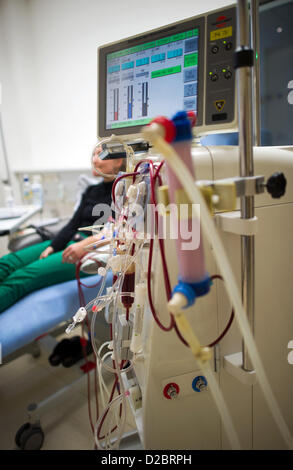 A dialysis patient is connected to a dialysis machine for blood purification at the University Hospital Carl Gustav Carus in Dresden, Germany, 16 January 2013. Photo: Arno Burgi Stock Photo