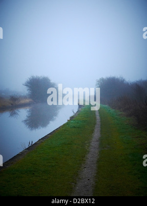 Trent and Mersey Canal on a misty winter morning in Sandbach Cheshire UK Stock Photo