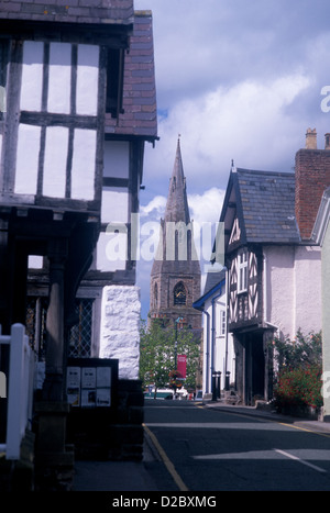 St Peter's Church viewed down Castle Street with medieval half-timbered houses on either side Ruthin Denbighshire North Wales UK Stock Photo