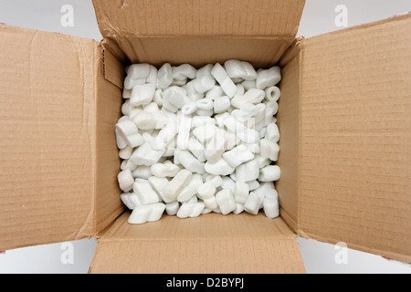 A cardboard box with packing foam pellets top view Stock Photo