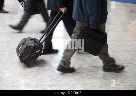 Cologne, Germany, managers are in a hurry with his luggage on the way Stock Photo