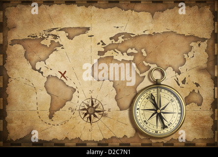 aged brass antique nautical compass and old map with track on it Stock Photo