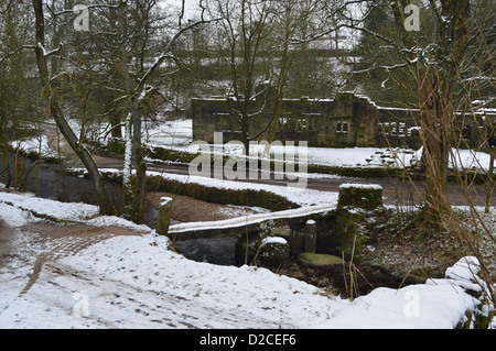 The Hamlet of  Wycoller in winter near the Bronte Way with The Packhorse Bridge, Clapper Bridge and Wycoller Hall Stock Photo