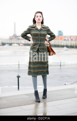 Pretty model wearing Vintage Striped 1960's Skirt Suit Stock Photo