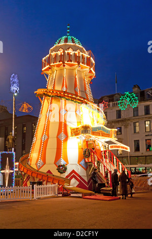 Child about to go onto an illuminated Helter Skelter in George Square, as part of the Glasgow Loves Christmas celebration. Stock Photo