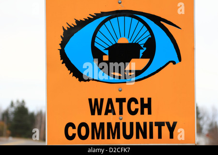 A neighborhood community watch sign beside a road Stock Photo