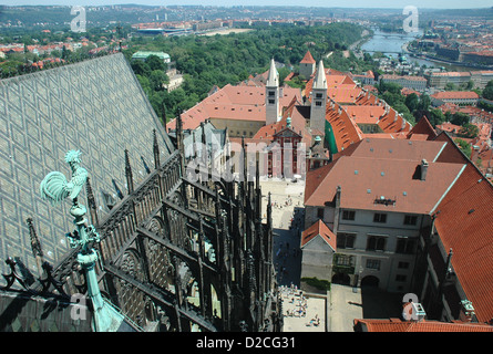 View East over Prague castle from the top of the St Vitus Cathedral tower in Prague castle. St. George's Basilica in the middle. Stock Photo