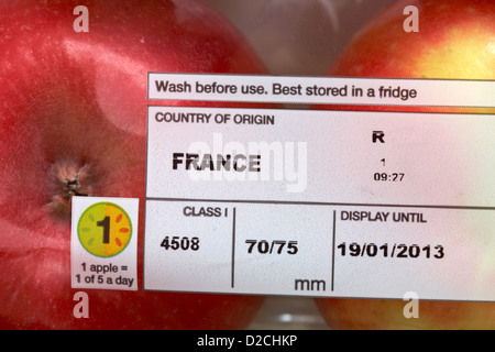 information of pack of apples country of origin France, display until, wash before use, best stored in a fridge1 apple = 1 of 5 Stock Photo