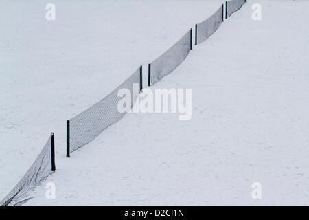 20th January 2013. Wimbledon London UK.   Tennis courts in Wimbledon are covered in snow with freezing temperatures affecting the UK as further snow fell on London Stock Photo