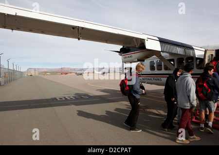 tour group boarding dehaviland otter sightseeing tour aircraft at Grand canyon west airport Arizona USA Stock Photo