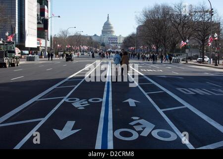 January 20, 2013, Washington DC. Washington visitors stroll along Pennsylvania Avenue which is closed to vehicular traffic in preparation for the inauguration ceremony of President Barack Obama.  The president was officially sworn in today due to a constitutional requirement that presidents be sworn in before noon on January 20. Stock Photo