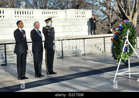 US President Barack Obama and Vice President Joe Biden render honors at the Tomb of the Unknowns January 20, 2013 at Arlington National Cemetery, VA. It is a tradition for the President to honor the Unknown Soldiers on Inauguration Day. Stock Photo