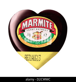 Small Heart Shaped Individual Portion Marmite Tub isolated on white background Stock Photo