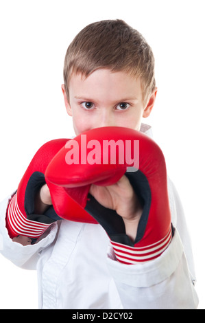 Boy wearing tae kwon do uniform and boxing gloves Stock Photo