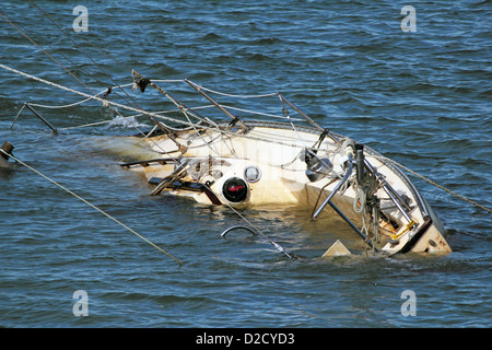 A boat taking on water and sinking in Murrells Inlet, South Carolina. Can be used as concept. Stock Photo