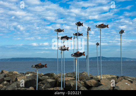 Salmon sculpture on the breakwater at the marina in Edmonds, Washington, USA Stock Photo