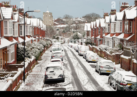 Residential area after snowfall. Bakewell Road, Eastbourne, East Sussex, UK. Also showing Saint Mary's Church in the background. Stock Photo