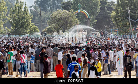 ADDIS ABABA, ETHIOPIA– JANUARY 19: Holy water sprayed on thousands of people attending Timket celebrations of Epiphany, commemorating the baptism of Jesus in the river of Jordan, on January 19, 2013 in Addis Ababa. Stock Photo