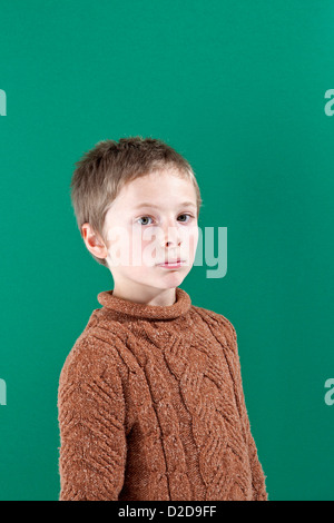 Portrait of a boy looking up at the camera Stock Photo - Alamy