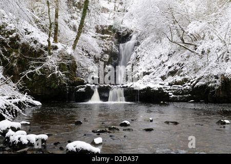 Snow covered Sgwd Einion Gam  Waterfall on the Pryddin River Ystradfellte Brecon Beacons National Park Wales Cymru UK GB Stock Photo