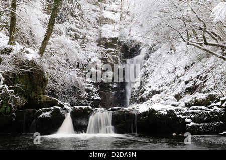 Snow covered Sgwd Einion Gam  Waterfall on the Pryddin River Ystradfellte Brecon Beacons National Park Wales Cymru UK GB Stock Photo