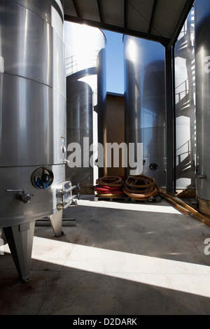 Modern stainless steel wine tanks at a winery Stock Photo