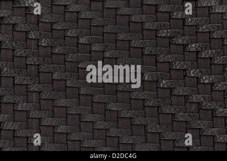 Close-up photo of weaving of black leather and fabric Stock Photo