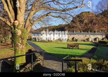 Traditional Welsh cottages overlooking green in picturesque Beddgelert village in Snowdonia National Park Gwynedd North Wales UK Britain Stock Photo