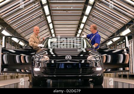 Employees of Volkswagen Saxony in Zwickau are inspecting a new Golf 7 on 9 November 2012. The production is at its peak one day before the market introduction of the seventh generation on 10 November 2012. Stock Photo