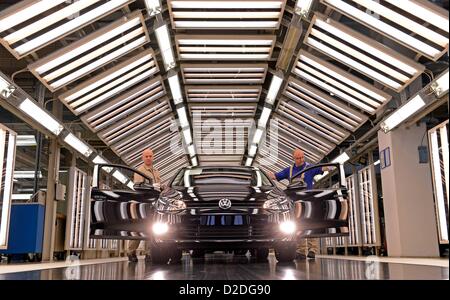 Employees of Volkswagen Saxony in Zwickau are inspecting a new Golf 7 on 9 November 2012. The production is at its peak one day before the market introduction of the seventh generation on 10 November 2012. Stock Photo