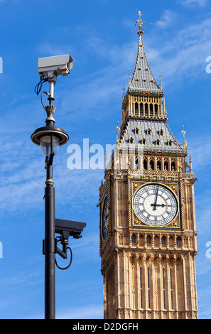 CCTV security cameras mounted on a lamp post in Westminster with Big Ben in the background. Stock Photo