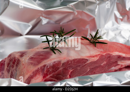 Raw Joint Of British Half Shoulder Of lamb With Rosemary Stock Photo