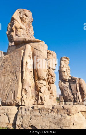 two gigantic statues known as the Colossi of Memnon West bank of Luxor Egypt Middle East Stock Photo