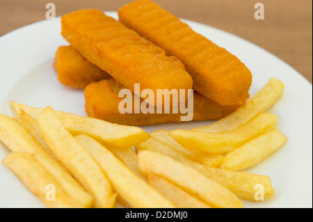 Plate of fish fingers and chips. Stock Photo