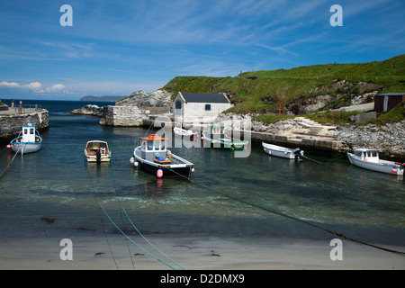 Fishing boats moored in Ballintoy Harbour, Causeway Coast, County Antrim, Northern Ireland. Stock Photo