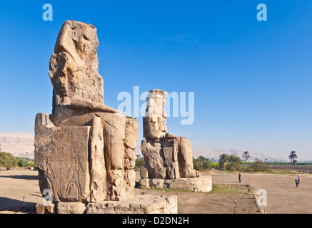 two gigantic statues known as the Colossi of Memnon West bank of Luxor Egypt Middle East Stock Photo