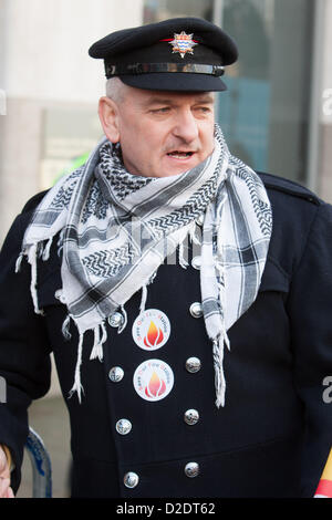 London, UK. 21st Jan, 2013. London firefighter wearing scarf at the London Fire and Emergency Planning Authority (LFEPA) meeting, protesting plans to close 12 fire stations, remove 18 fire engines and slash 520 firefighter posts. The lobby was  called by the London region of the Fire Brigades Union. Stock Photo