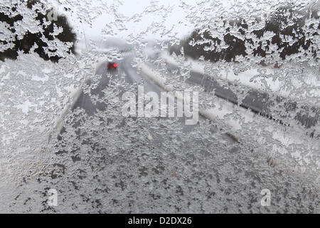Snow and sleet on a windscreen on the A1 near Morpeth, Northumberland. The snow reduces visibility and makes driving conditions difficult. Stock Photo