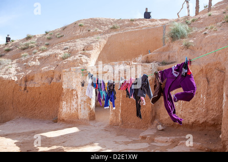 Typical yard of an underground house of troglodytes in Tunisian village Matmata, Tunisia. Stock Photo