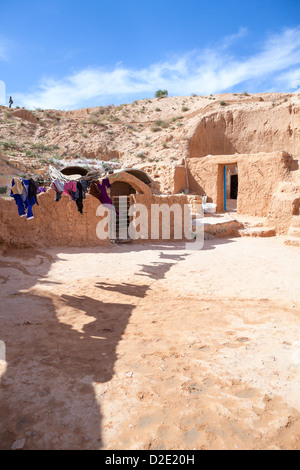 Typical yard of an underground house of troglodytes in Tunisian village Matmata, Tunisia. Stock Photo